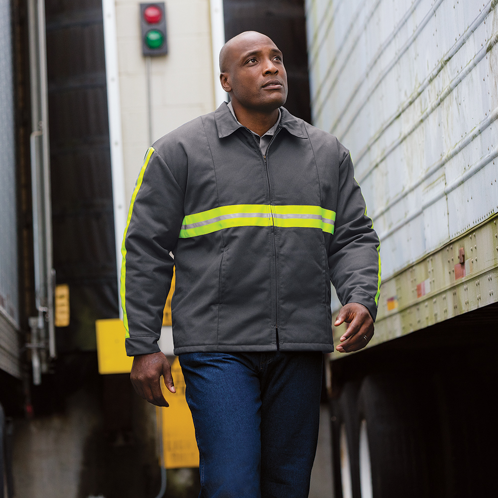 Man at the loading docks wearing a Dempsey Uniform enhanced visibility jacket
