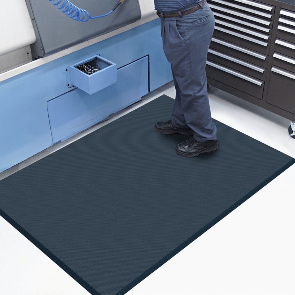 Man standing on a Dempsey Uniform complete comfort mat