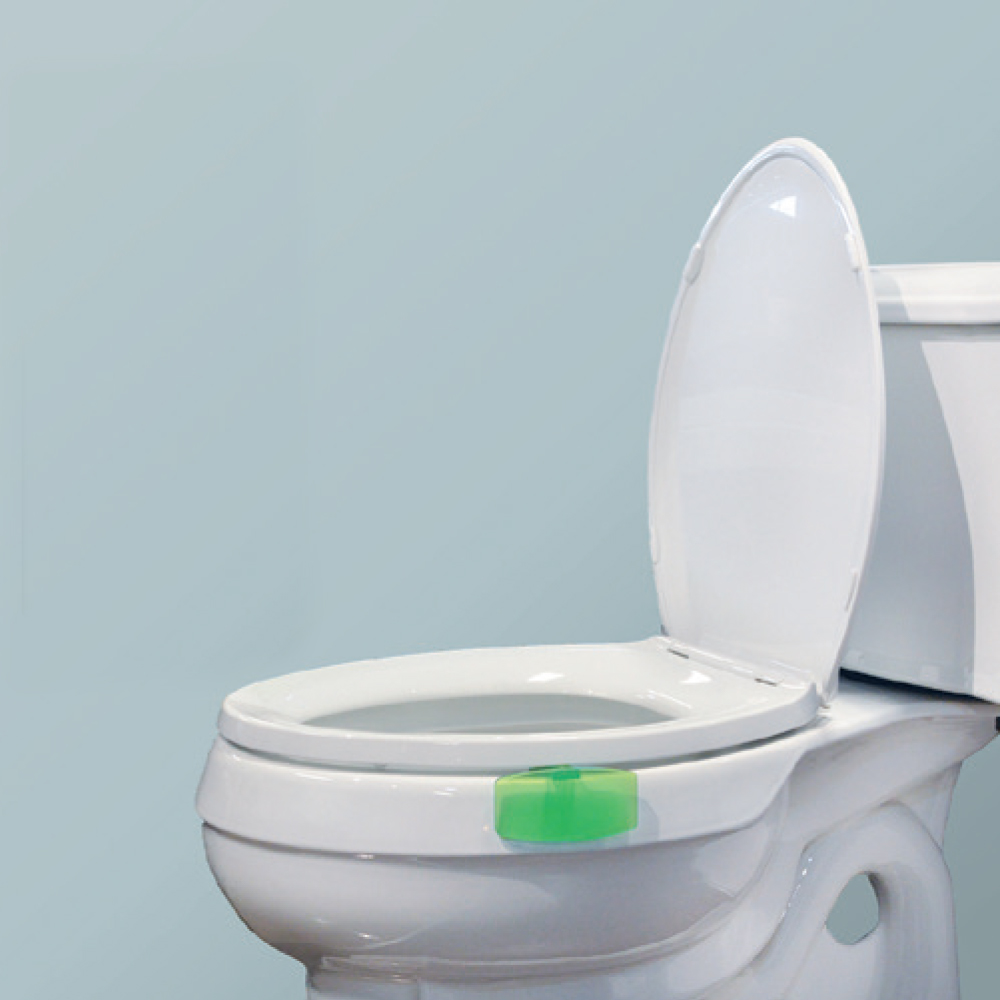 Dempsey Uniform Eco Clip freshener installed in a toilet bowl