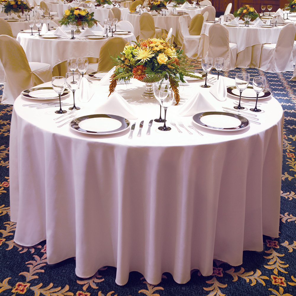White Dempsey Uniform round tablecloth in a table setting